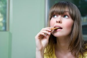 Woman Eating Cookie
